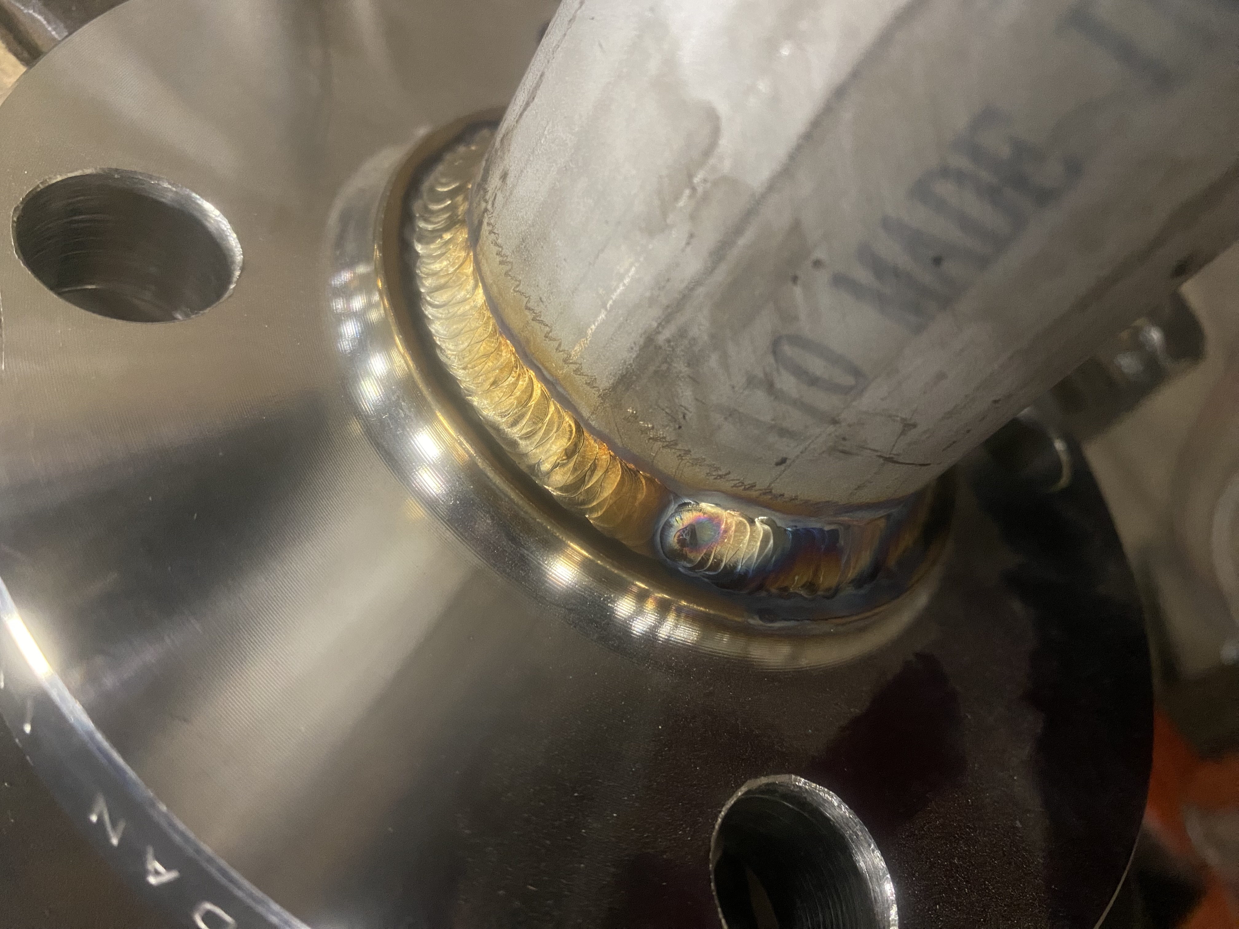 TIG weld on stainless steel flange - close-up detail shot